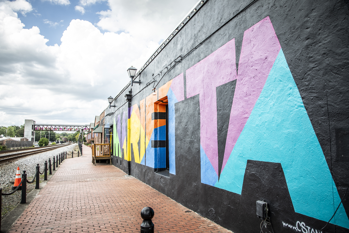 marietta square with wall mural by train tracks
