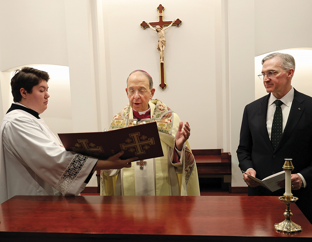 Supreme Chaplain Archbishop William Lori blesses the oratory altar at the McGivney House of Formation during the dedication ceremony Jan. 23.