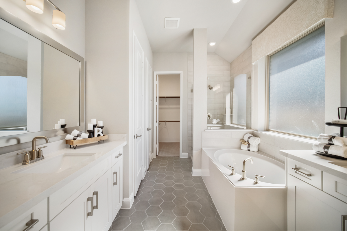 primary bathroom with geometric tile floor
