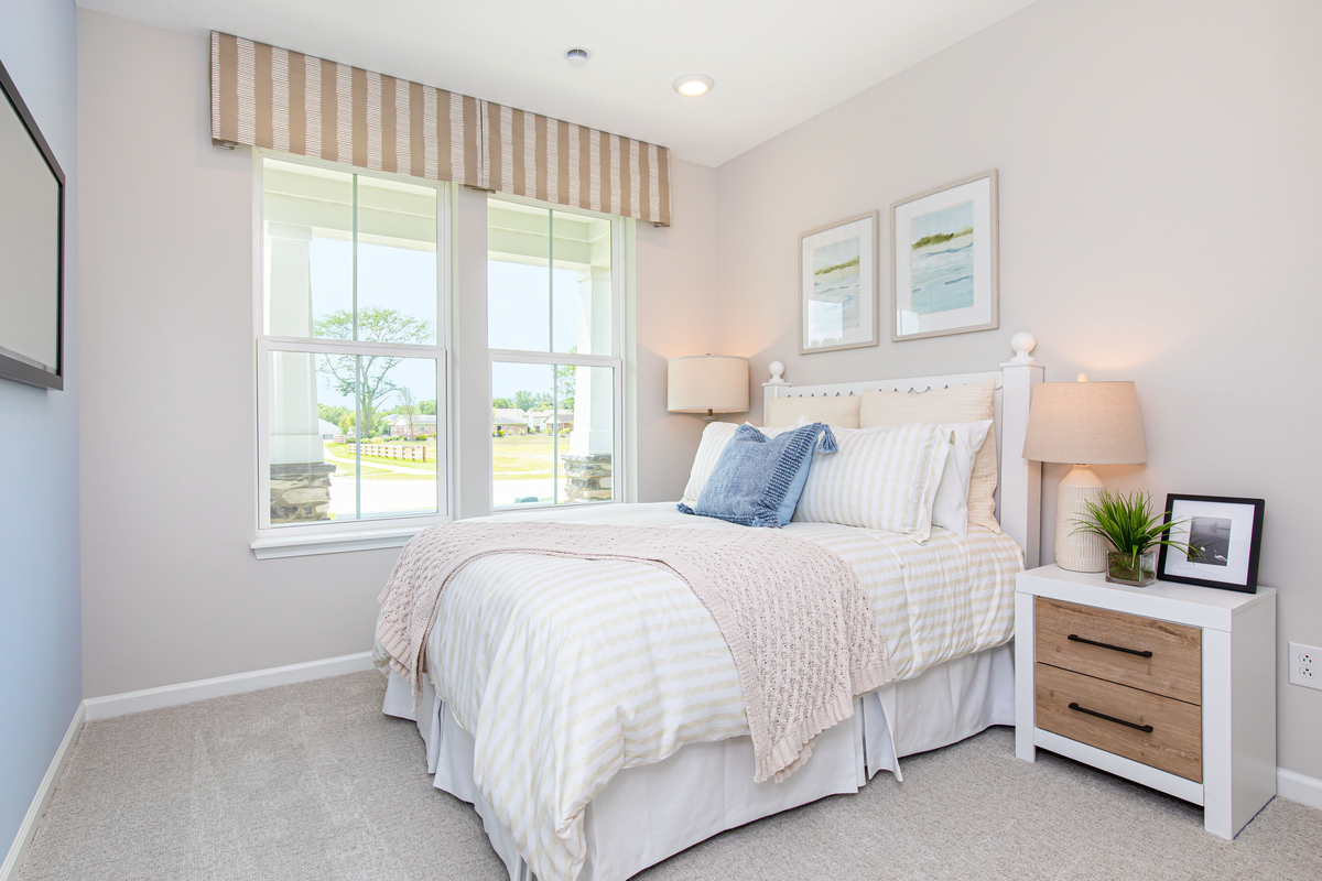 bedroom with full size bed and blue accents