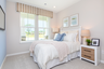 bedroom with full size bed and blue accents