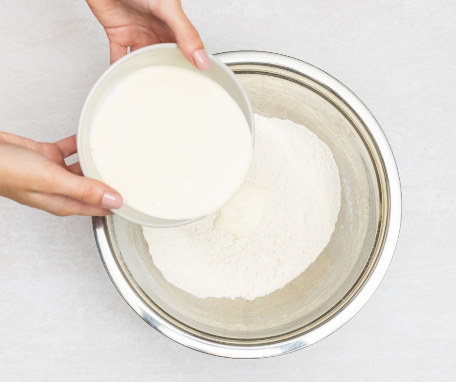 Mothers Day Recipe, Pink Lemonade Scones Step 2, Sift Flour into bowl and add pouring cream.