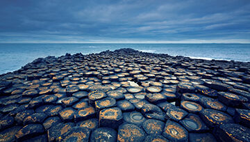 Rocky coastline under a cloudy overcast sky