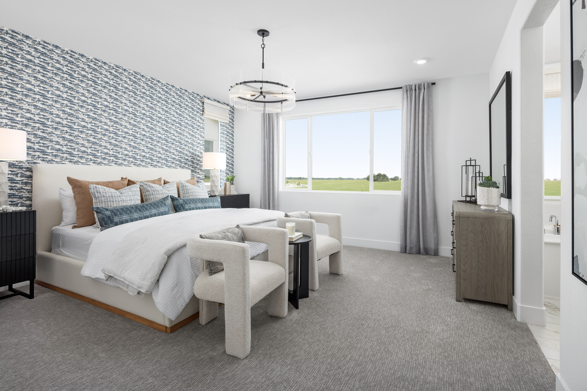 bedroom with white bed, and large window