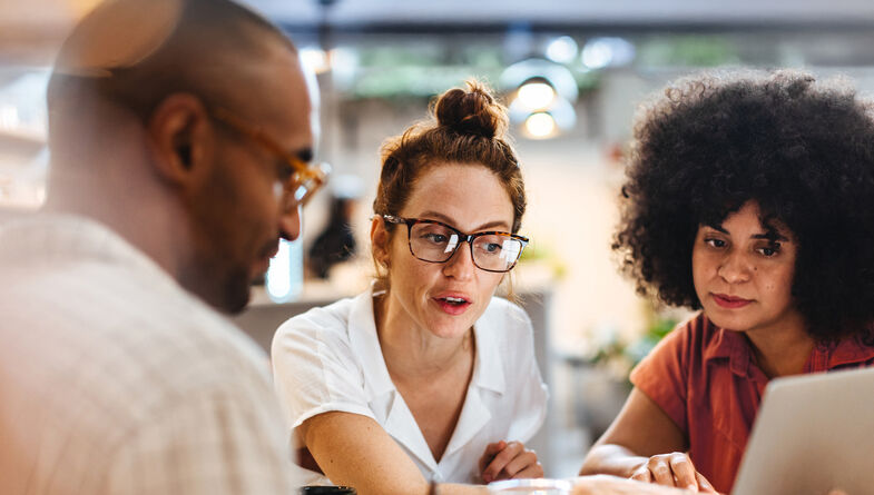 Business women discussing with client over lunch