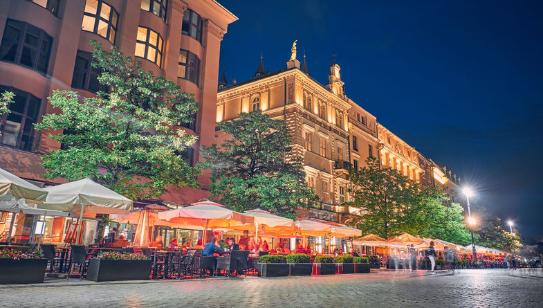 Outdoor restaurant with outdoor seating at night