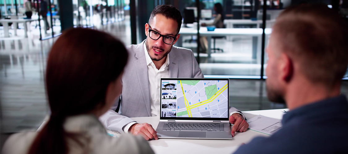 Buyers and an agent looking at a listing page