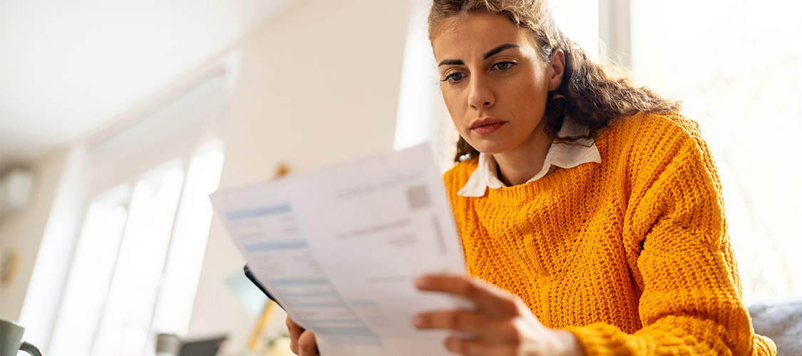 A woman looking at paperwork.