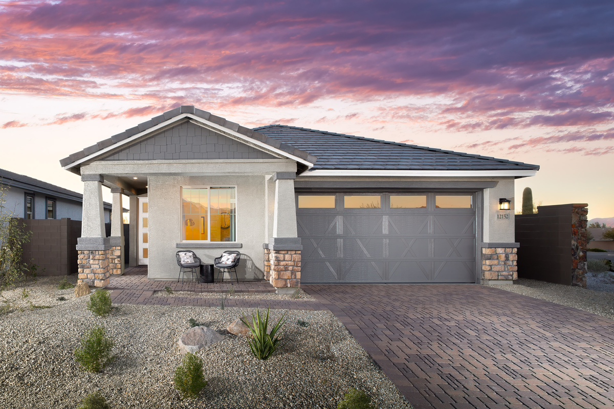 single-story home with desert landscaping 