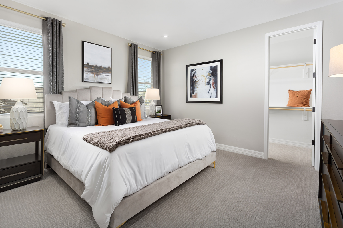 large bedroom with bed and nightstand