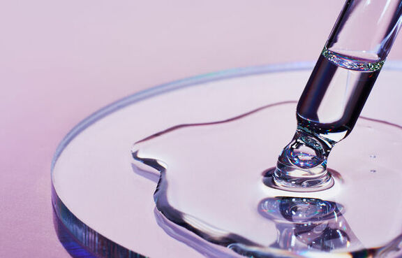 Petri dish with liquid from dropper 