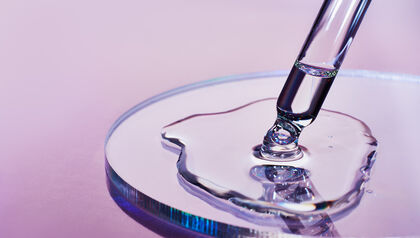 Petri dish with liquid from dropper 