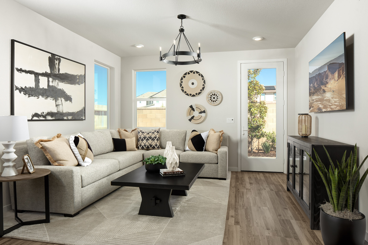 great room with wood floors, and tan sectional 