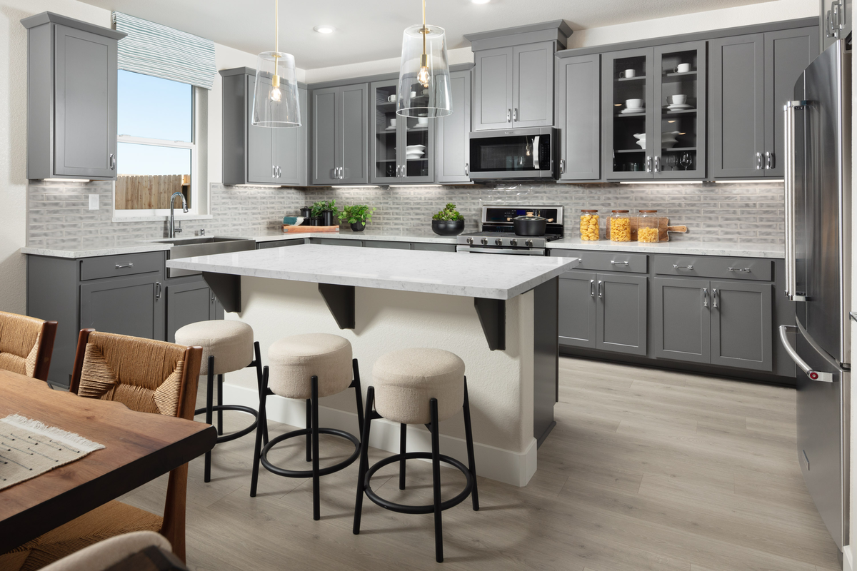 kitchen with gray cabinets and white counters