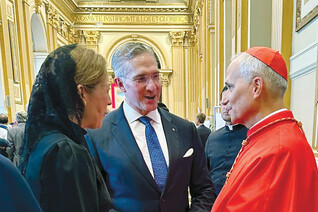 Supreme Knight Patrick Kelly and his wife, Vanessa, speak with Cardinal Prevost on Sept. 30, 2023