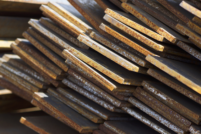 Pile of profile clad metal strip