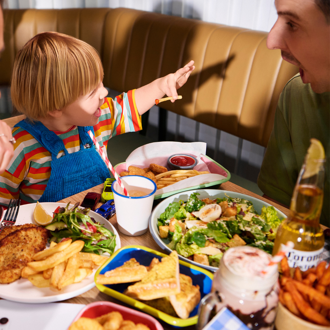 family enjoying lunchat restaurant