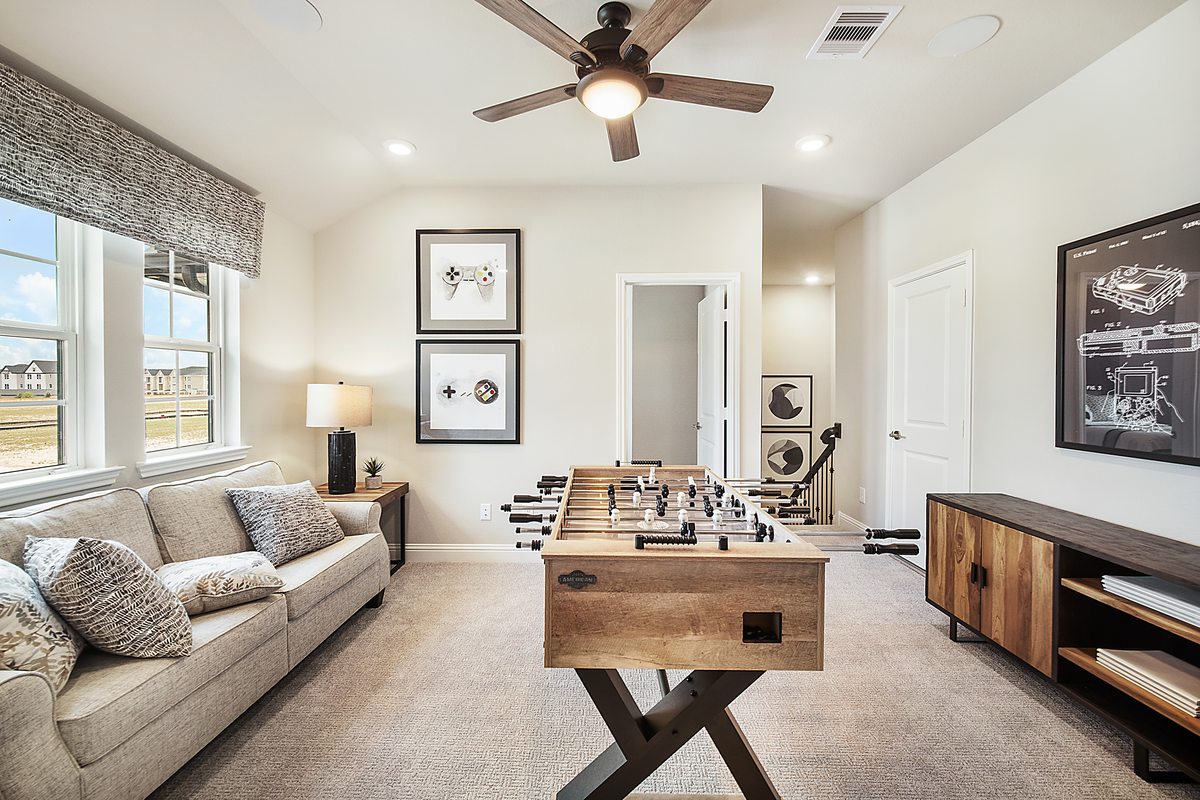 loft with foosball table and sitting area