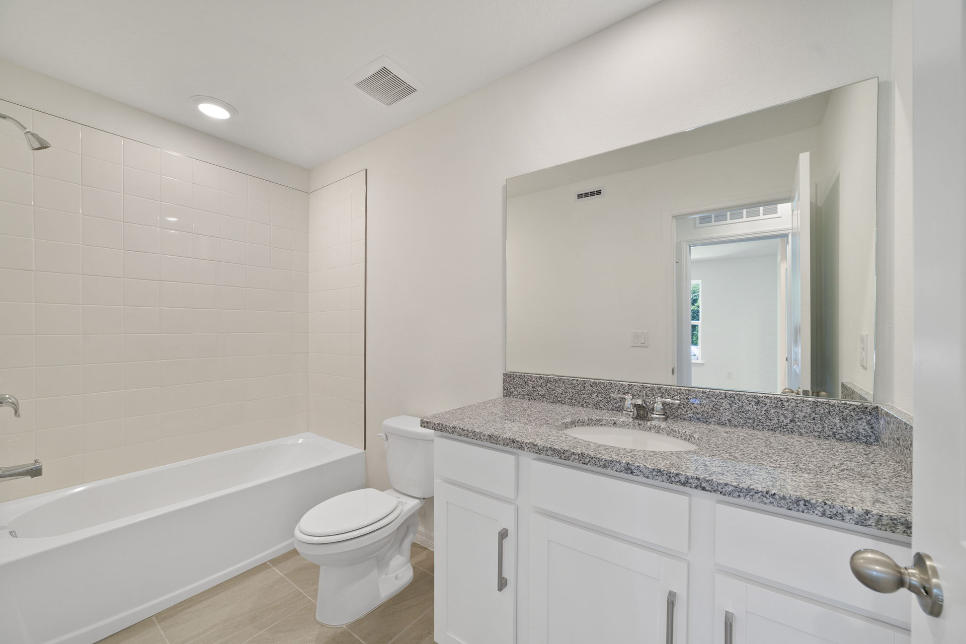 single sink vanity with water closet and tub