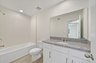 single sink vanity with water closet and tub
