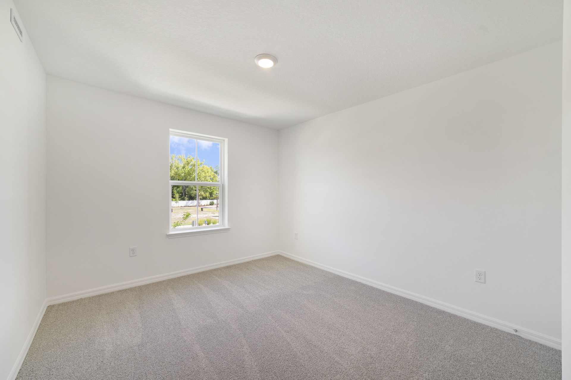 carpet throughout with a closet and a single window