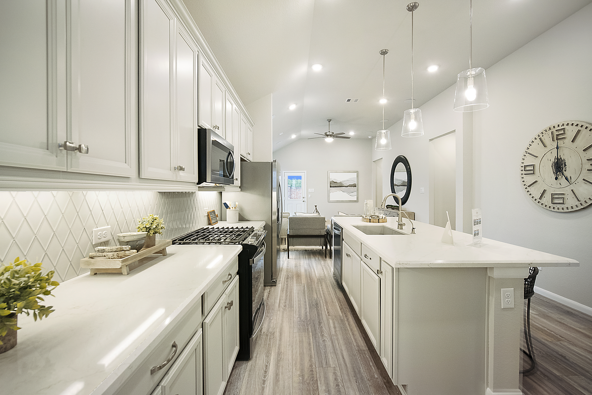 kitchen with glass pendant lighting and backsplash
