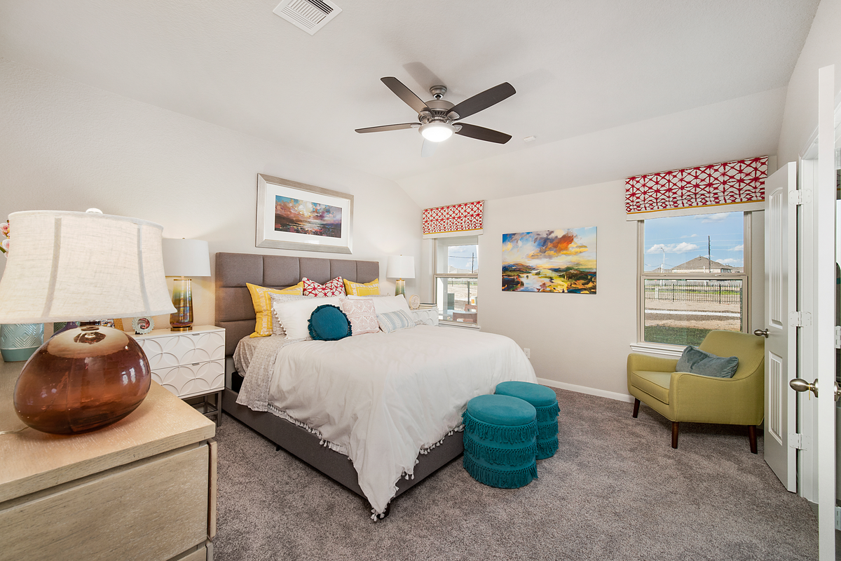 bedroom with natural light and ceiling fan