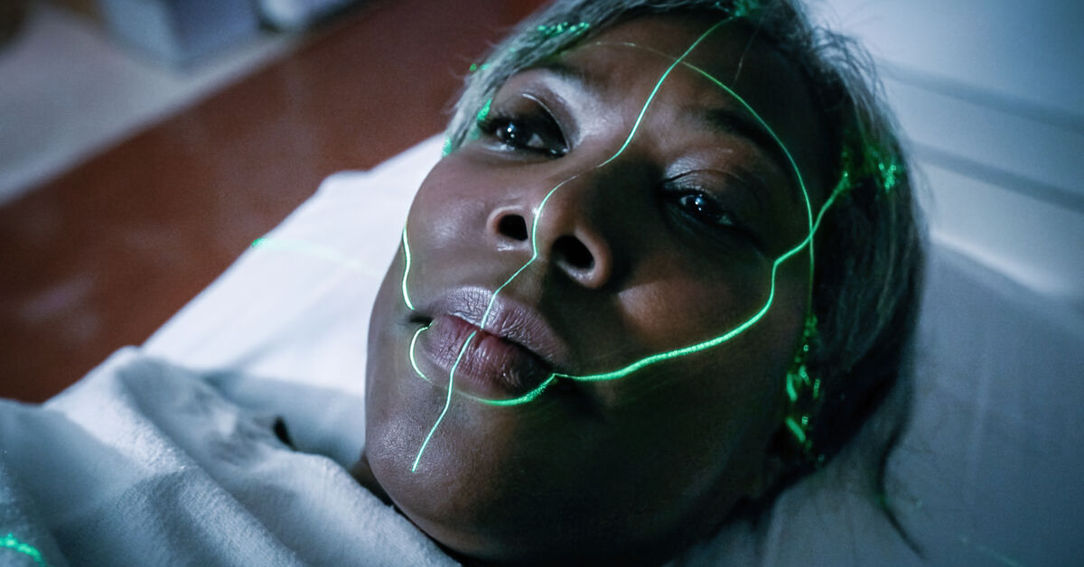A radiation beam highlighted on a patient's face