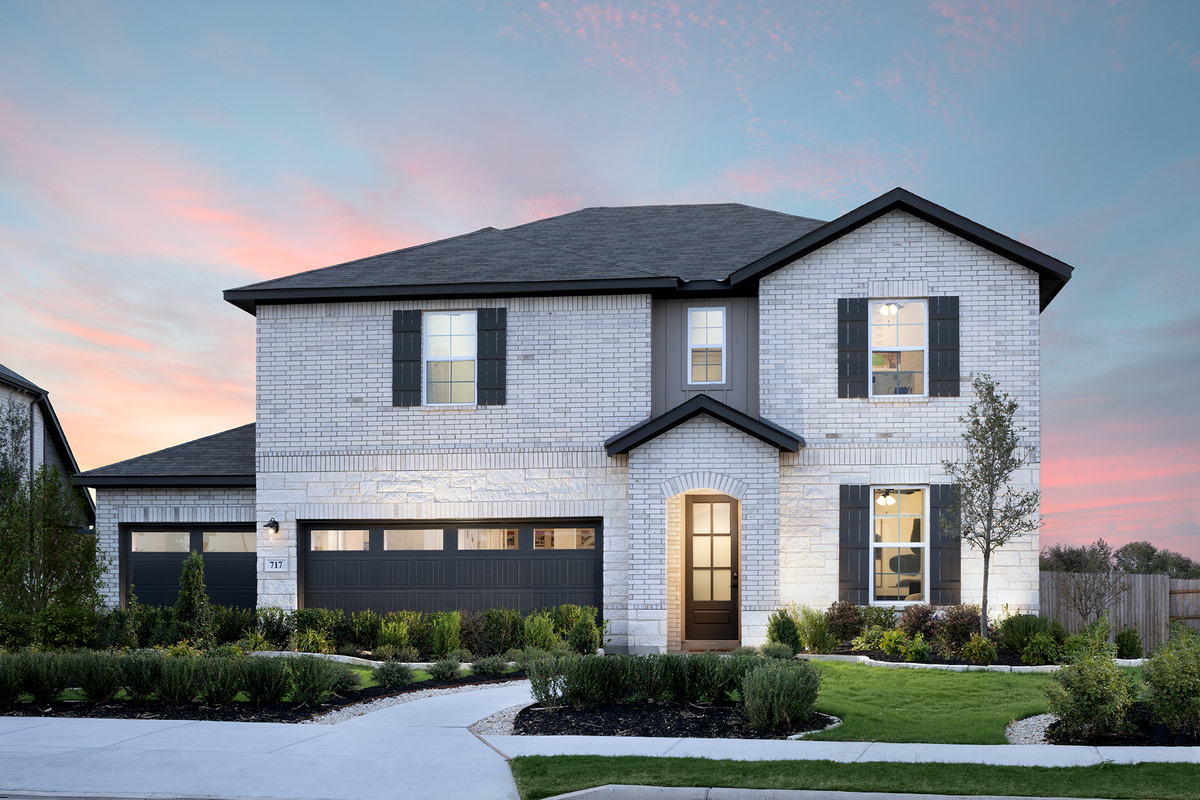  2-story brick exterior with 3-car garage 