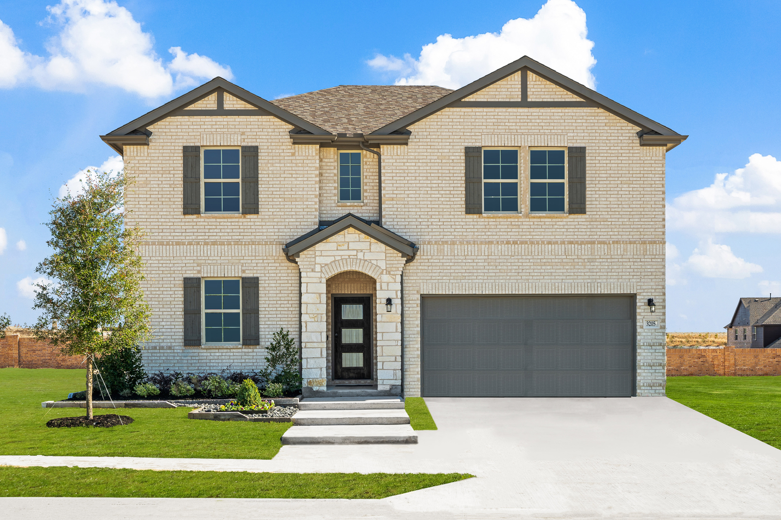 exterior with white brick and stone