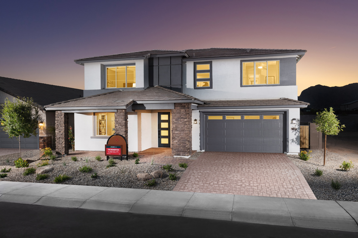two-story home with desert landscaping