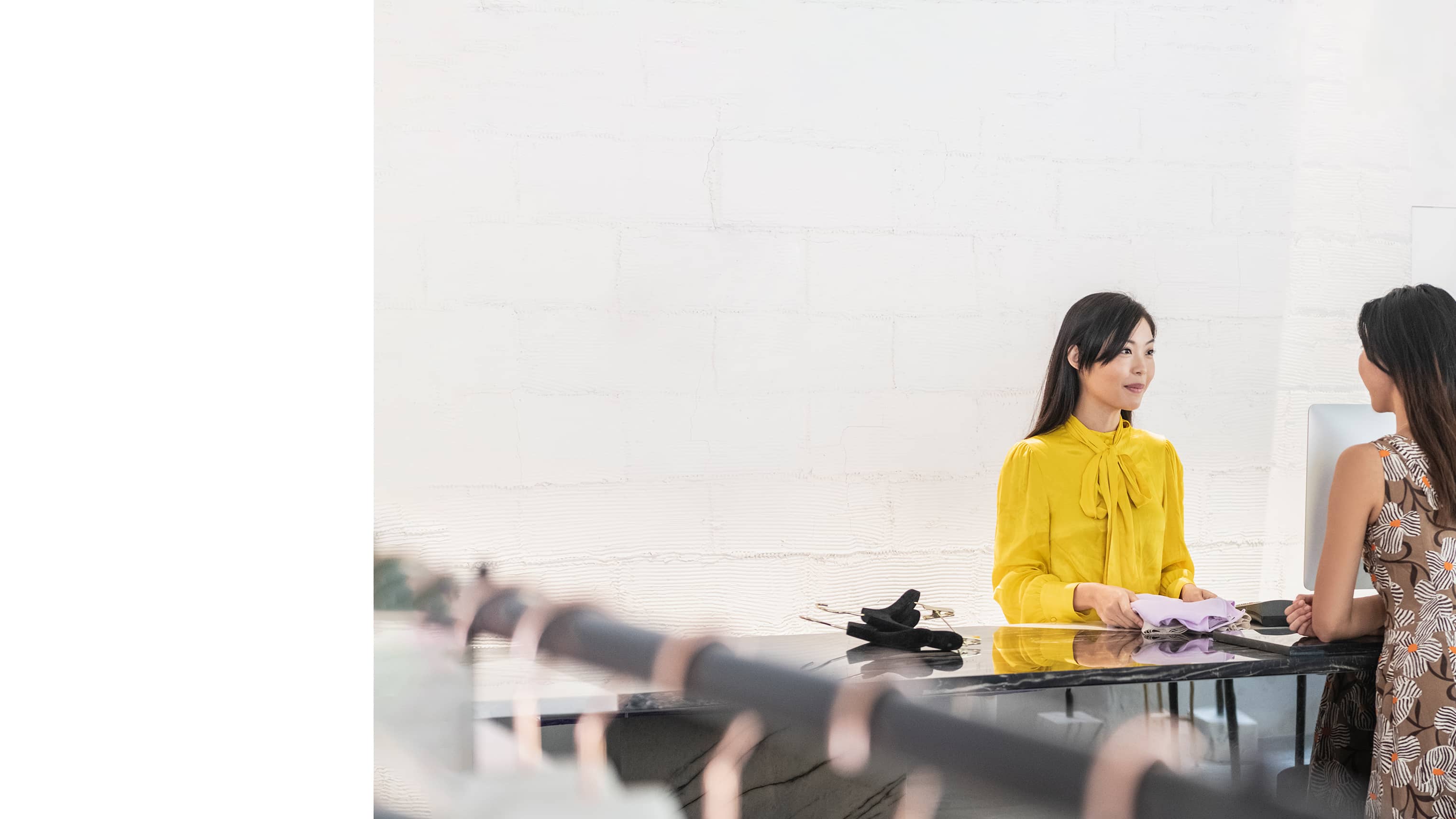 Retail associates in a store discussing logistics