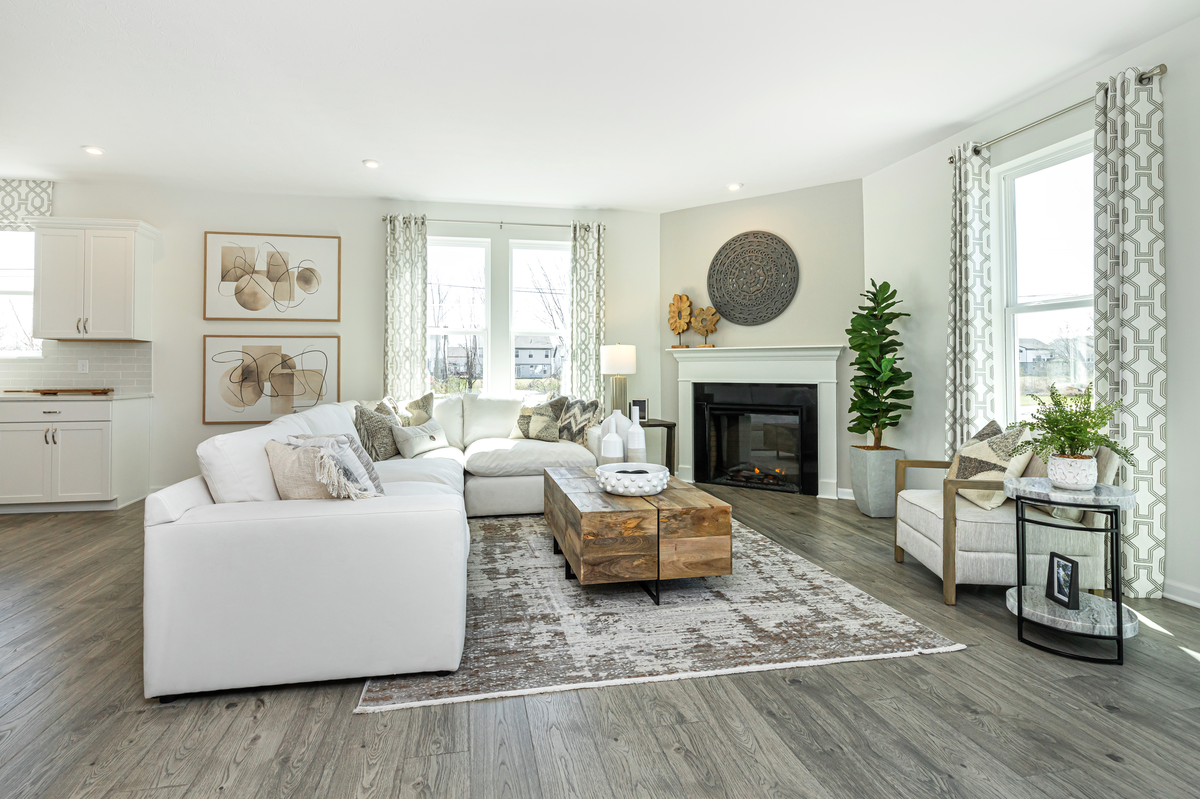 great room with fireplace and hardwood floors 