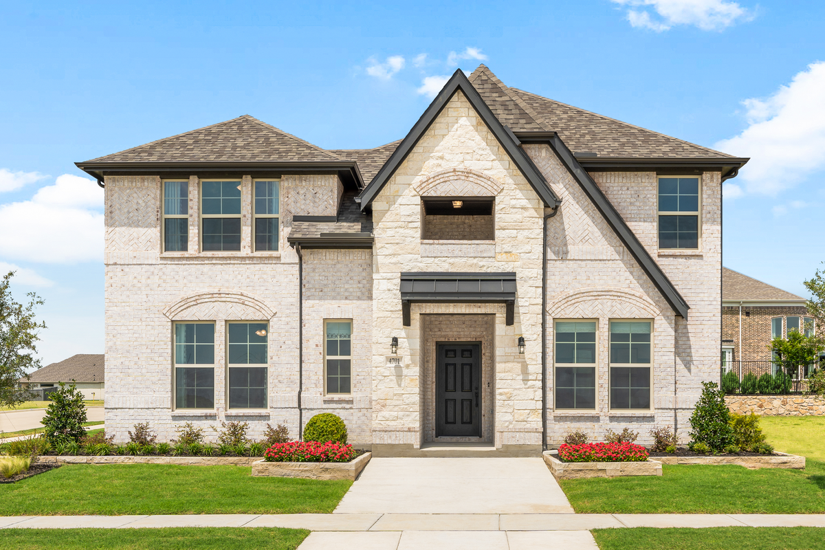 two-story home with stone and brick exterior