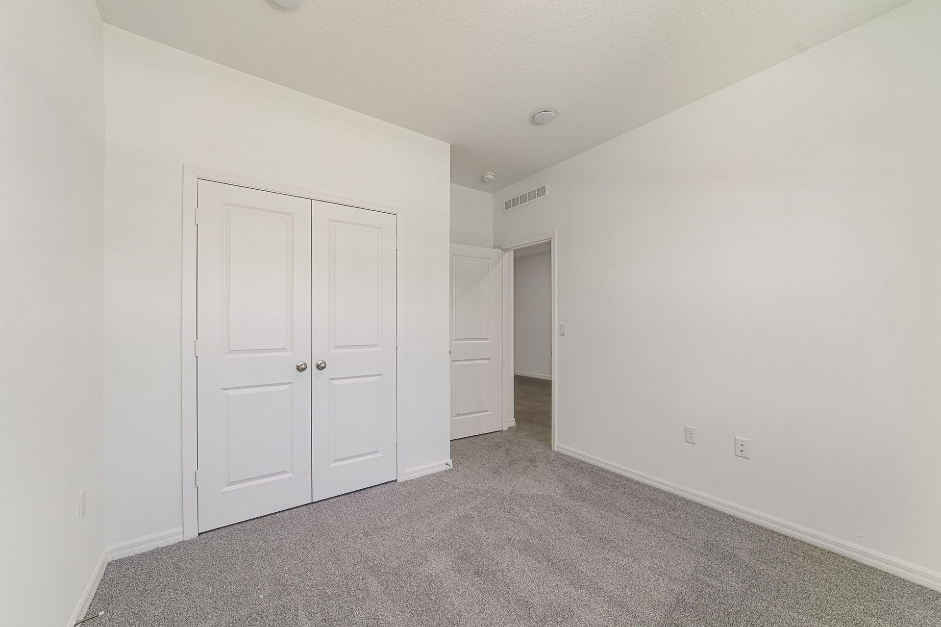 carpet throughout with single window and closet