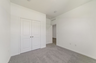 carpet throughout with single window and closet