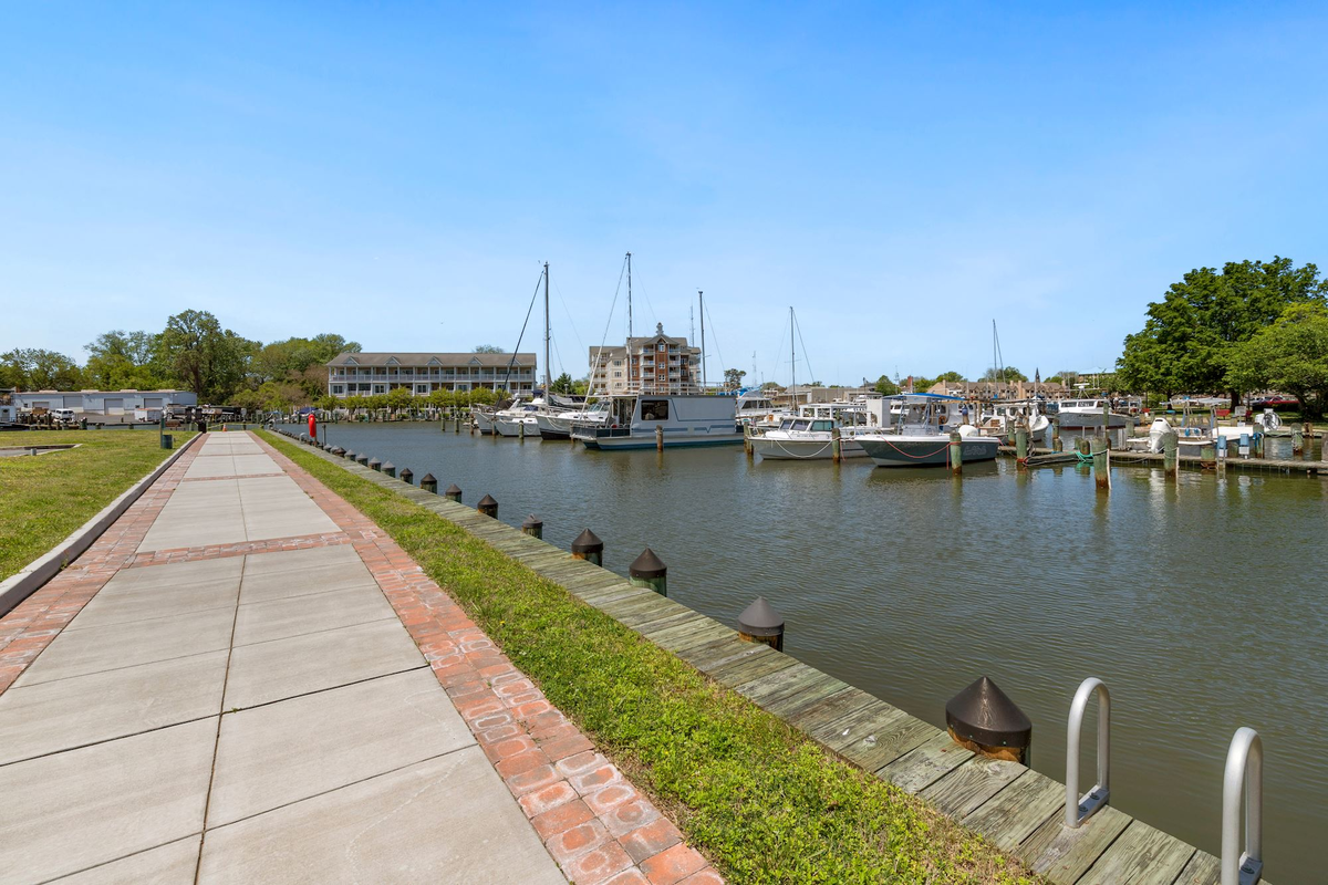 community riverwalk lines the marina
