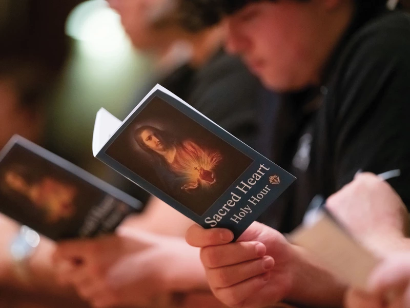 College Knights pray during a Pilgrim Icon prayer service at Providence College