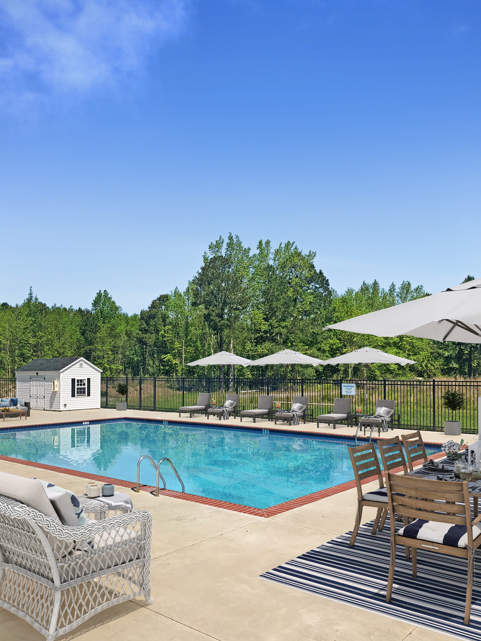 community saltwater pool with tables and umbrellas