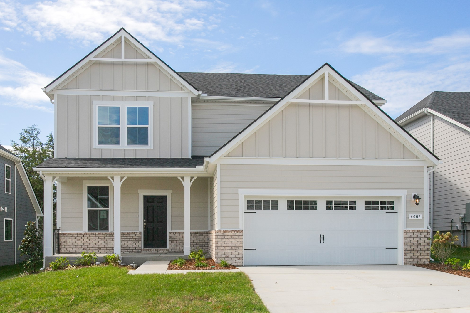 home exterior with brick and light-colored siding