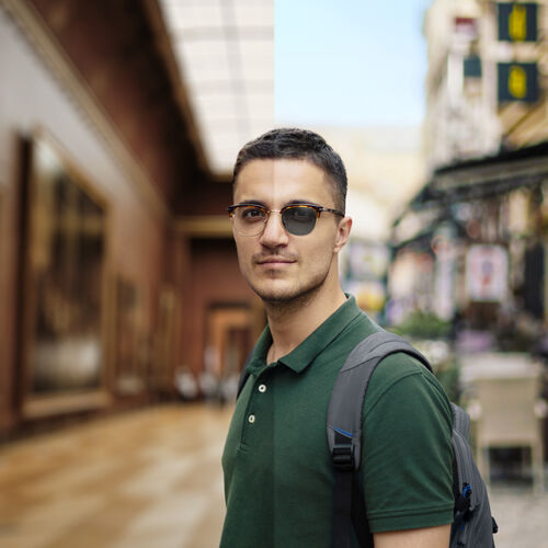 Man on holiday with light sensitive glasses
