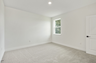 room with carpet throughout and single window