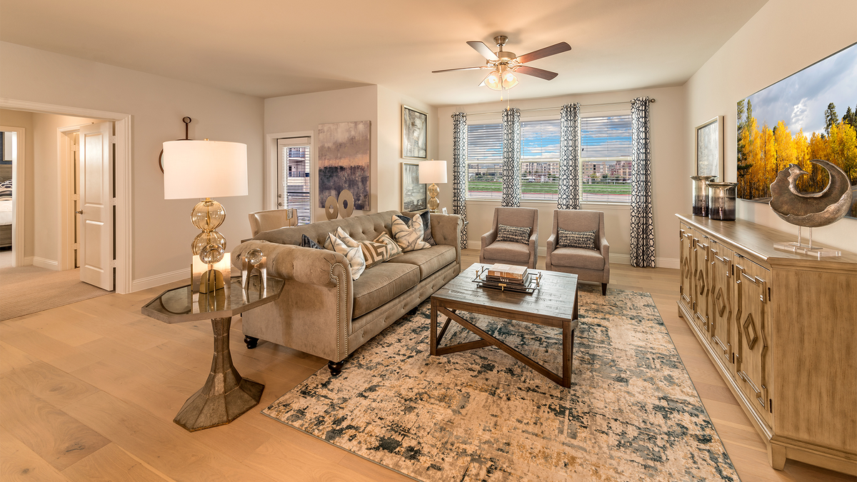 living room with wood flooring and large windows