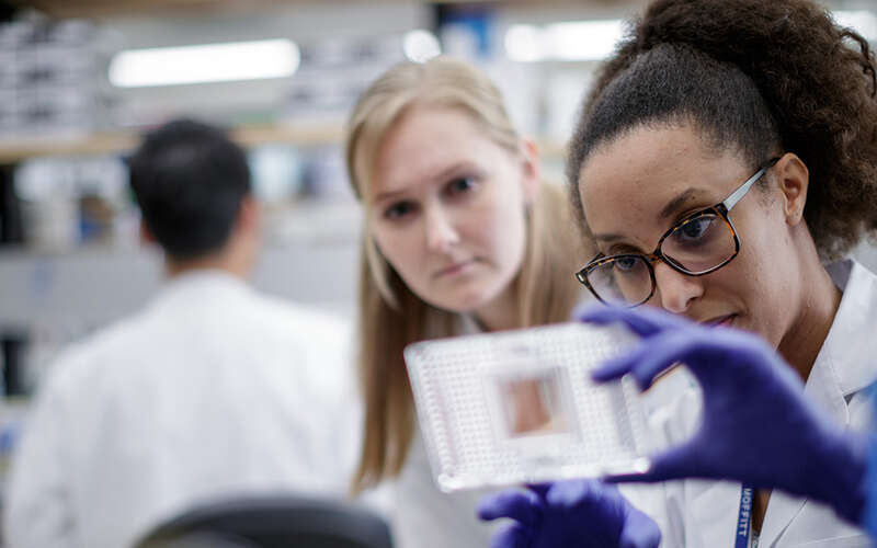 image of Inna Smalley and another researcher in a lab