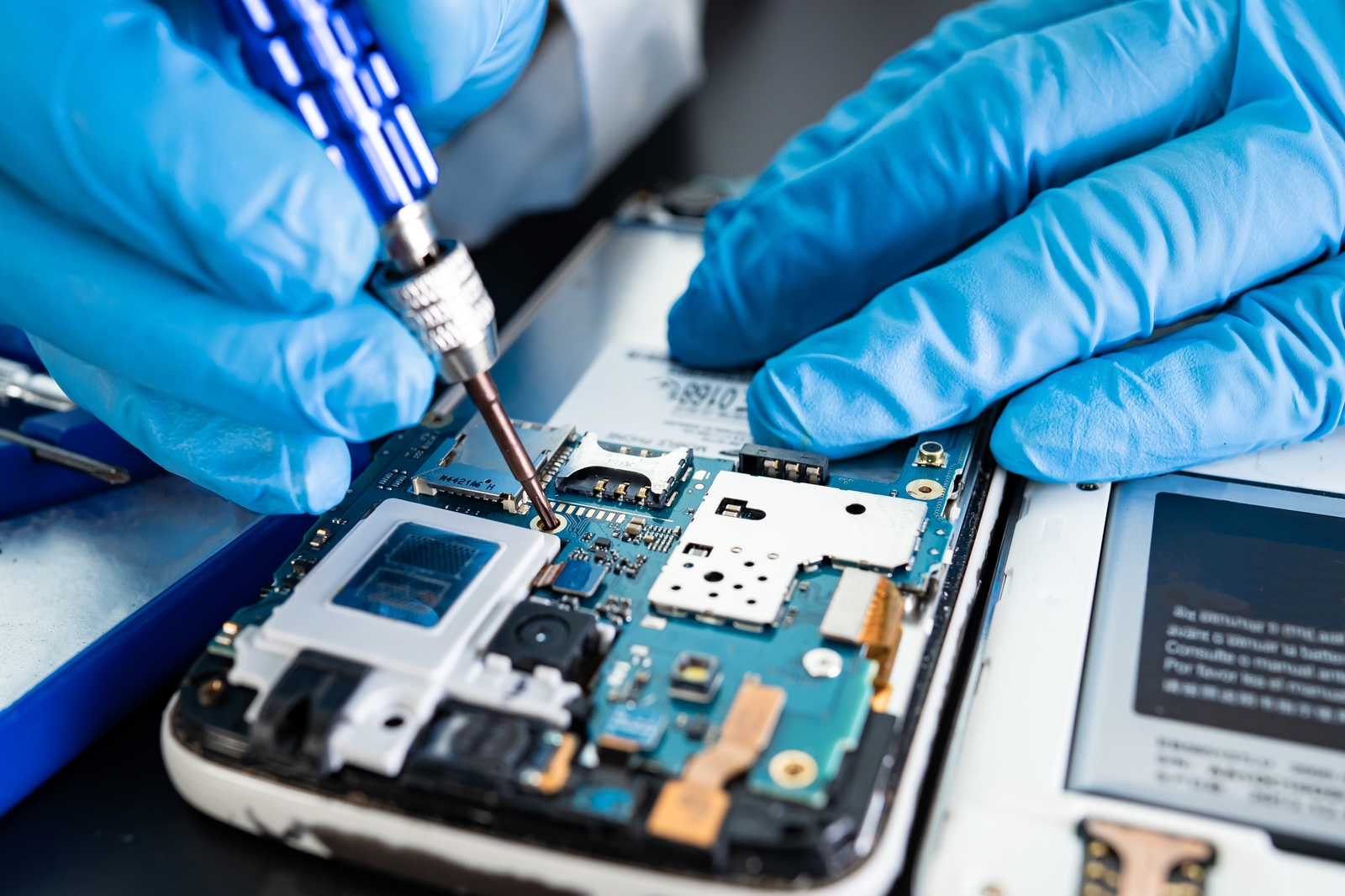 Smart phone with back off showing electronic components