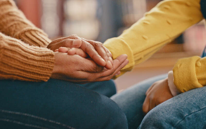 Hands touching in support