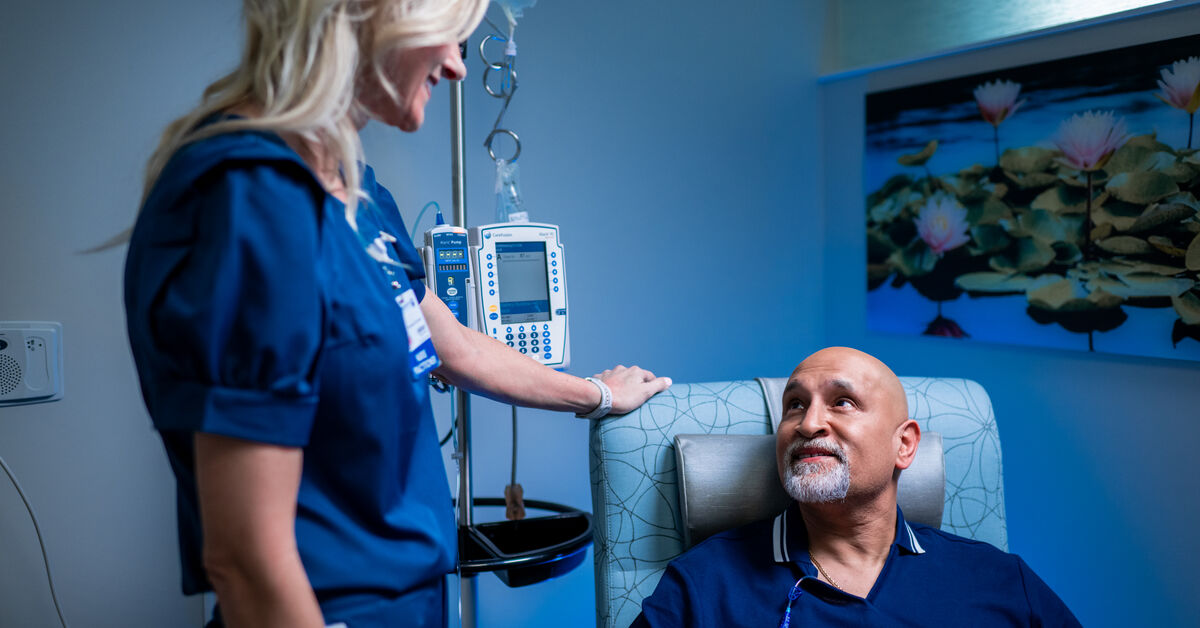 patient talks to nurse during chemo