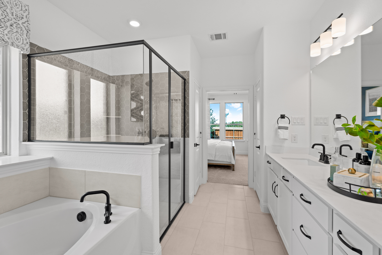 primary bathroom with walk-in shower and tub