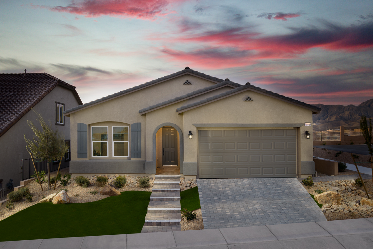 exterior with desert landscaping and sunset sky