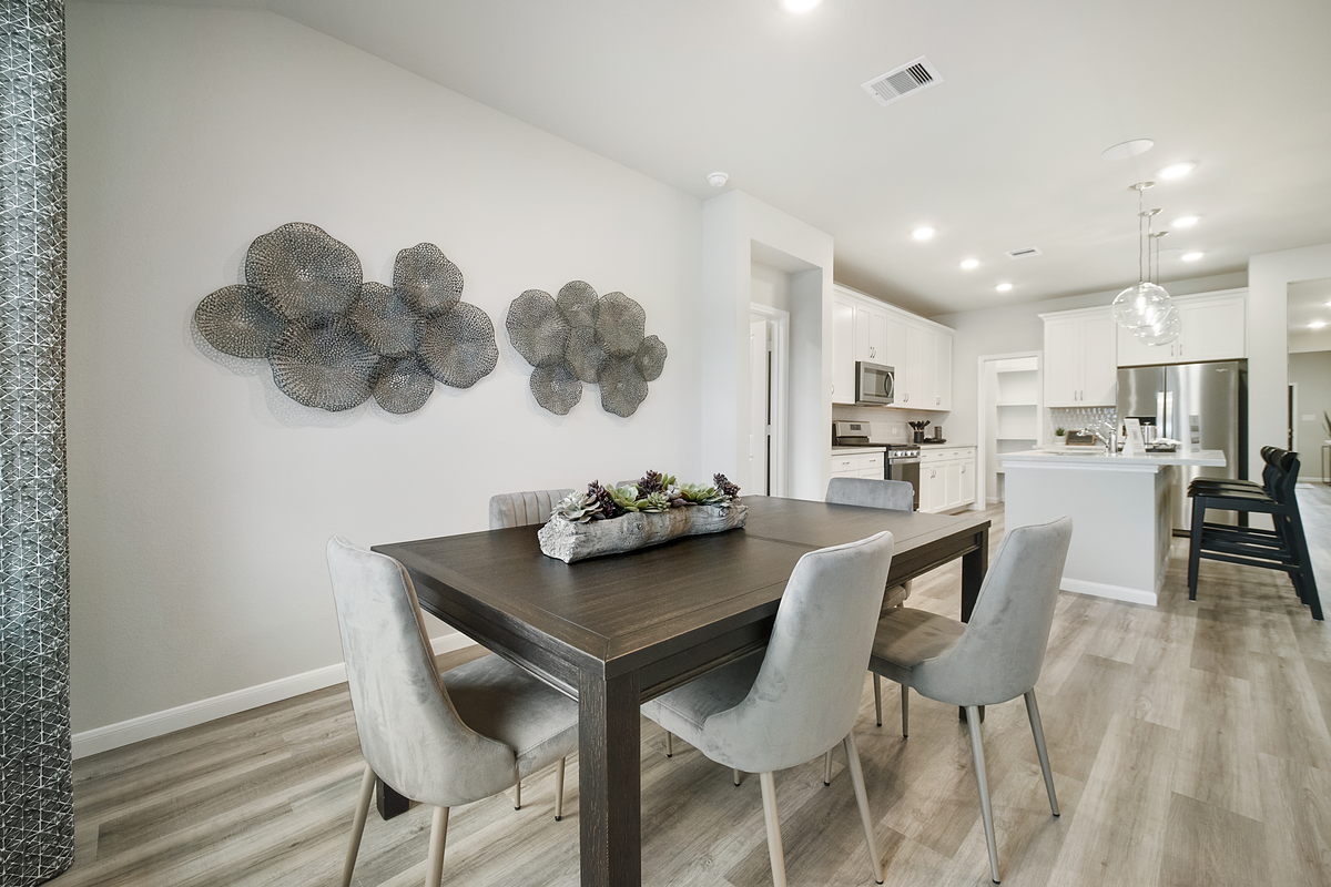 casual dining room with wood-like vinyl flooring